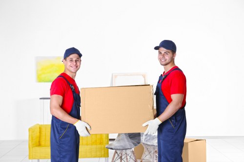 Boxes and office furniture prepared for a business move in Romford