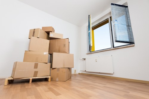 Professional movers loading furniture with care during a Romford removal