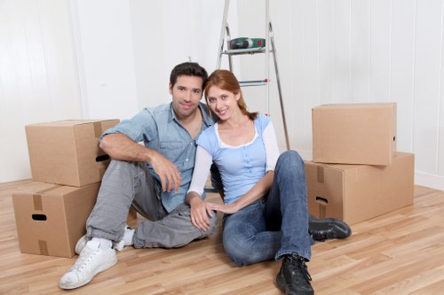 Packed moving boxes and furniture in a residential property