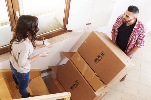 Loading furniture and boxes into a van for a Romford relocation