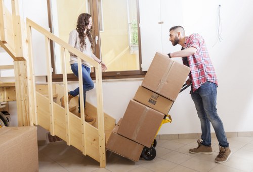 Packed office boxes and furniture ready for a business move