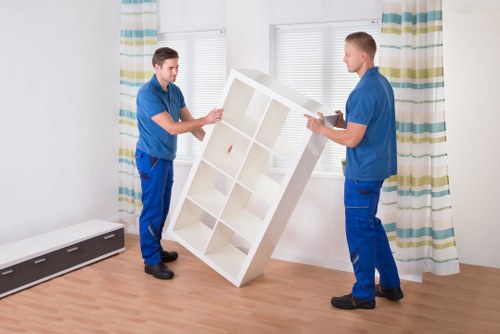 Loading furniture into a van for a local removal job in Romford