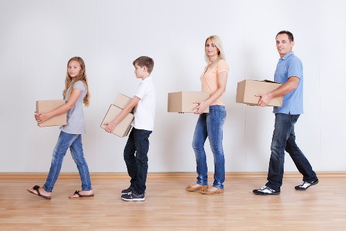 Moving crew using protective equipment during a house move