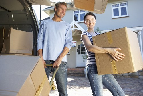Packed moving boxes and furniture ready for removal in a Romford home